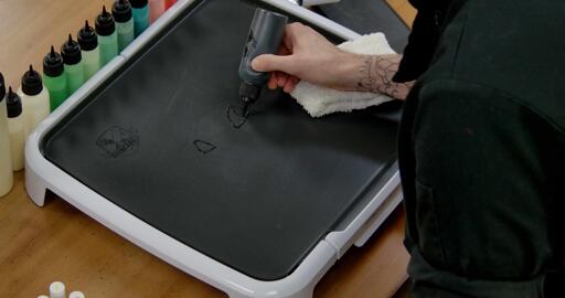 Bulbasaur pancake art step 1.1: Start by drawing the eyes and face of bulbasaur.