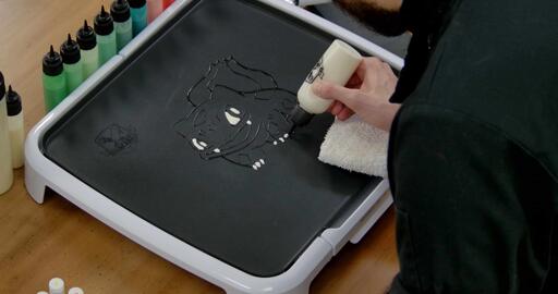Bulbasaur pancake art step 2.2: Fill in bulbasaur's teeth and claws with white batter.