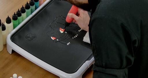 Bulbasaur pancake art step 2.3: Fill in bulbasaur's irises with red pancake batter.