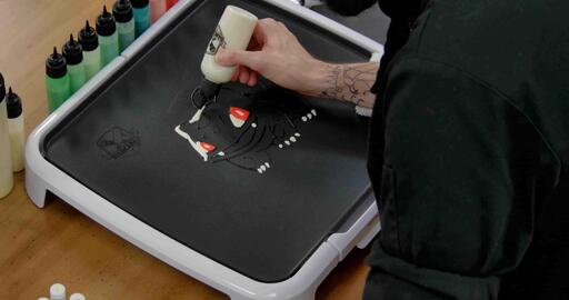 Bulbasaur pancake art step 3.1: Begin to add white highlights to the left side of bulbasaur's head and ears.