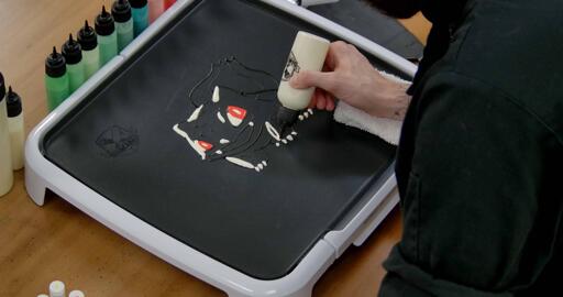 Bulbasaur pancake art step 3.2: Continue adding highlights to the left side of bulbasaur's arms.