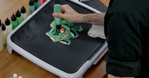 Bulbasaur pancake art step 6.2: Move on to your lighter blue-green batter and begin filling bulbasaur's body.