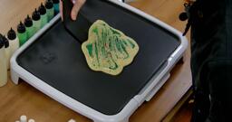 Bulbasaur pancake art step 8.3: When the pancake slides freely, it is no longer stuck to the surface of the griddle and you can move on to the next step: Flipping.