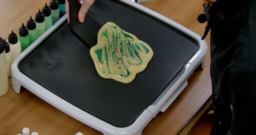 Bulbasaur pancake art step 8.3: When the pancake slides freely, it is no longer stuck to the surface of the griddle and you can move on to the next step: Flipping.
