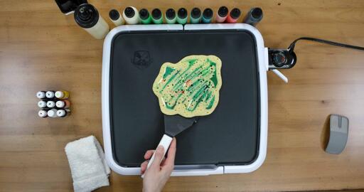 Bulbasaur pancake art step 9.1: Have confidence when you flip the pancake. Gently slide the spatula under the body of the pancake...