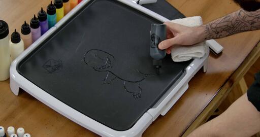 Charmander Pancake Art step 1.2: Continue on to outlining Charmander's arms, legs, stomach and tail.