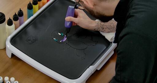 Charmander Pancake Art step 3.3: Now you can grab your darker purpler and fill in the rest of the space within Charmander's mouth.