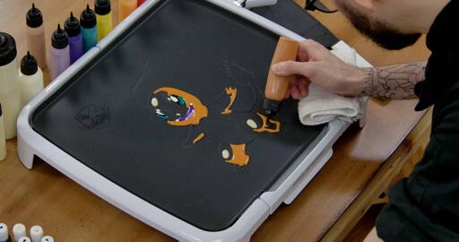 Charmander Pancake Art step 5.2: Continue to fill shading on the sides of Charmander's arms, legs and tail.