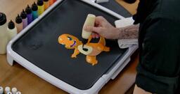 Charmander Pancake Art step 6.3: Using your plain batter, fill Charmander's belly and any area on the tail underside you missed.