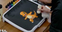 Charmander Pancake Art step 7.1: Time to fill in some final details. Using your white batter, color in Charmander's claws.