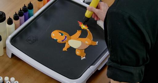 Charmander Pancake Art step 7.3: With a mix of red, orange, and yellow batters (you can have fun with this part) fill in the rest of Charmander's tail flame!