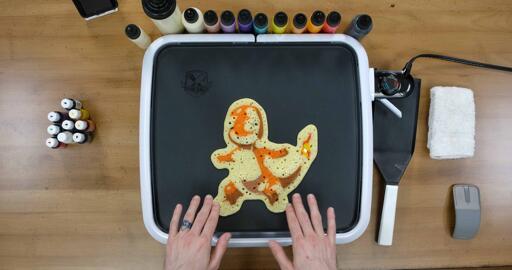 Charmander Pancake Art step 9.2: You want the whole back of the pancake to have popped bubbles, and for the surface to look like it isn't shiny anymore.