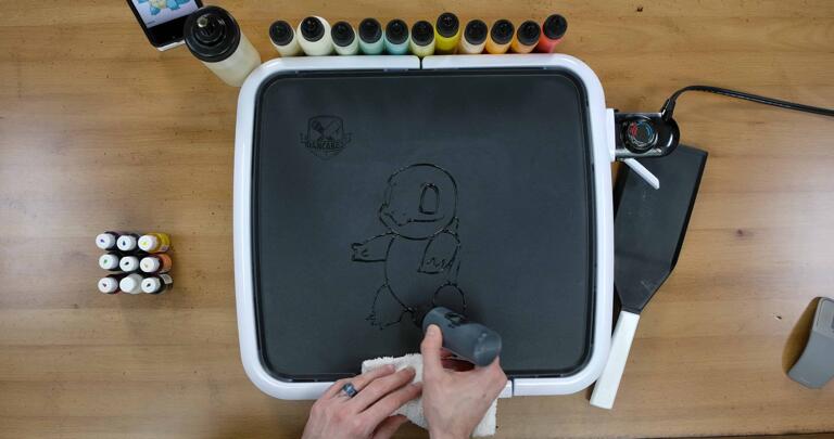 Squirtle Pancake Art step 1.2: Continue outlining Squirtle's body, belly, and shell.