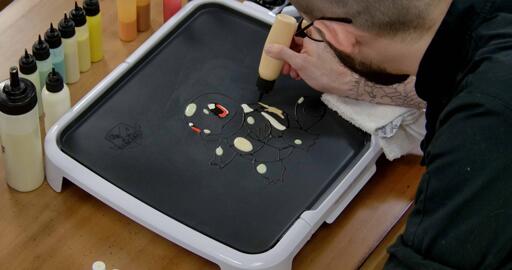 Squirtle Pancake Art step 3.3: Using your very light orange batter, add a jagged highlight to the back of Squirtle's shell.