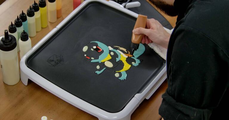 Squirtle Pancake Art step 4.3: Using your burnt orange/brown batter, shade the bottom of Squirtle's shell.