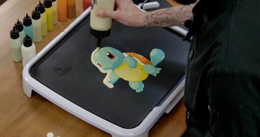 Squirtle Pancake Art step 6.1: Once a pancake design is all filled in, I like to add an outline of plain batter to give it some extra body and make it easier to flip without damaging the piece.