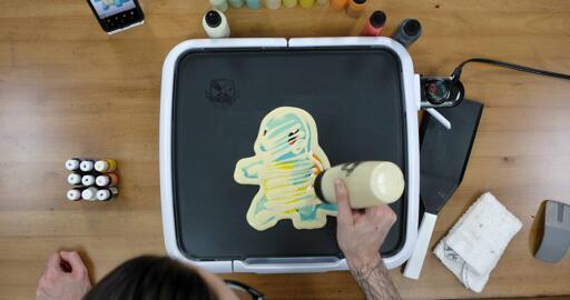 Squirtle Pancake Art step 6.3: At the very end of this step, I like to drizzle some extra batter across the back of the pancake to make sure I didn't miss any spaces.