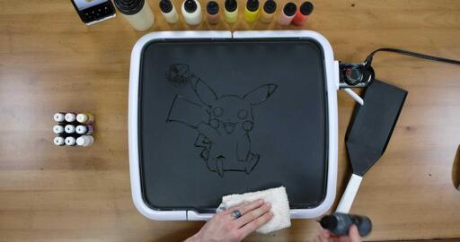 Pikachu Pancake Art step 1.3: Keep outlining Pikachu's feet, back, and that iconic zig-zag tail! Your outlines don't have to be perfect, you'll get better with practice, and remember: Mistakes are Delicious!