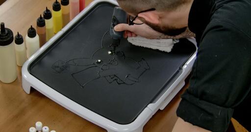 Pikachu Pancake Art step 2.2: Now, switch back to your black batter and color in the rest of pikachu's eyes black.