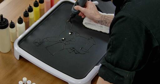 Pikachu Pancake Art step 2.3: While you're still holding your black batter, go ahead and color in the black tips of pikachu's ears. Simple stuff!