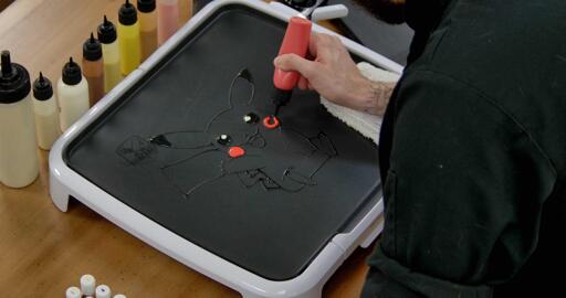 Pikachu Pancake Art step 3.1: Grab your red batter and color in those famously rosy cheeks!