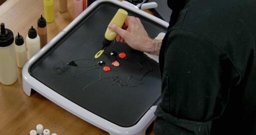 Pikachu Pancake Art step 4.1: Now it's time for highlights! With your lightest yellow batter, begin marking places on pikachu's body where the 'light' hits the character. A rounded oval on the head...