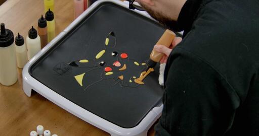 Pikachu Pancake Art step 5.2: ...spots under Pikachu's arms and feet, and on the bottom of the body...