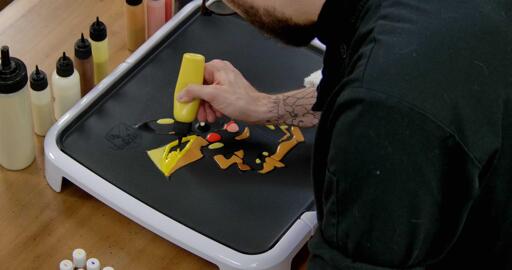 Pikachu Pancake Art step 6.1: It's time to color it all in! Once highlights and shading has been applied, you can grab your bold yellow batter and color in the rest of the pancake. This process can be very relaxing; take your time; the more methodical you are, the more satisfying the process will be!