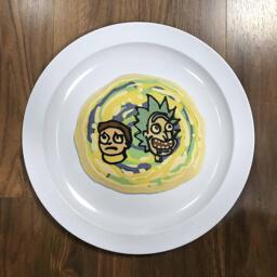 An image of a pancake drawn in the shape of Rick and Morty from the cartoon Rick and Morty, suspended within a green and yellow portal.