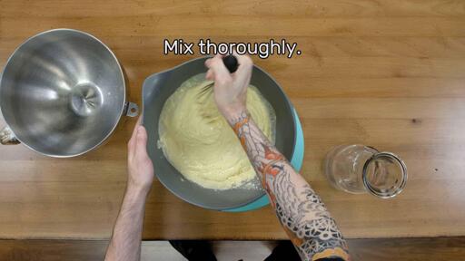 This image shows the liquid and dry ingredients being mixed together and says