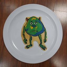 Pancake art of Mike Wazowski With Two Eyes Meme.